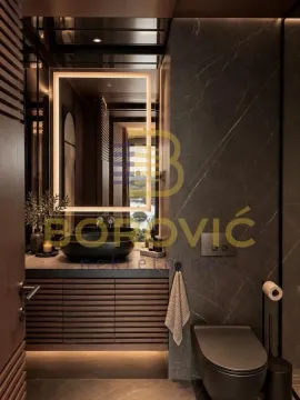 Moderno kupatilo sa umivaonikom, osvetljenim ogledalom i WC šoljom u tamnim tonovima. - image 18