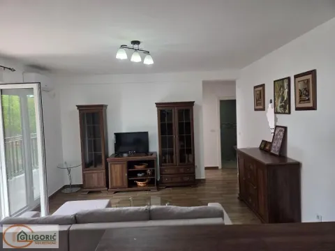Living room with sofa set, wooden furniture and access to the terrace. - image 4