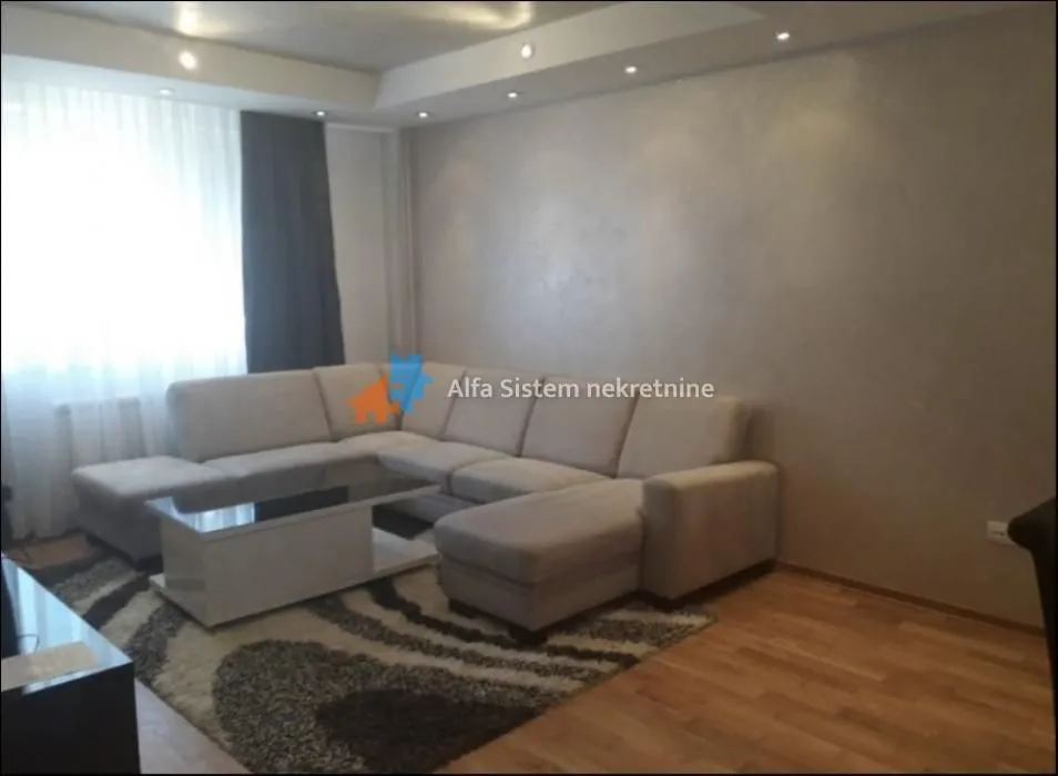 Living room with a sofa set and a coffee table.