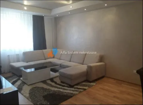 Living room with a sofa set and a coffee table. - image 2