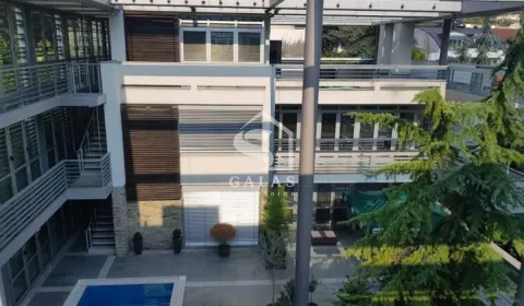 View of the exterior of the building with a courtyard and terraces. - image 7