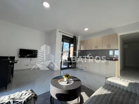 Living room with kitchen and dining area. - image 3