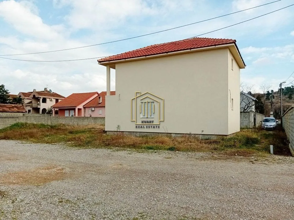Exterior view of the house with a yard.