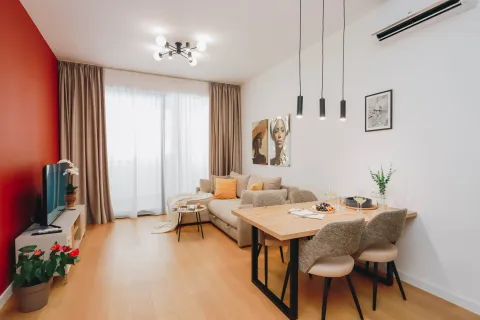 Living room with dining area, sofa and TV unit. - image 5