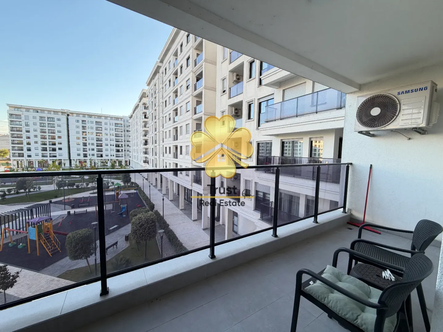 View from the terrace of the residential building and the courtyard with a children's playground.