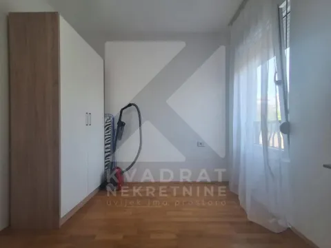 Smaller bedroom with a built-in wardrobe and a window. - image 6