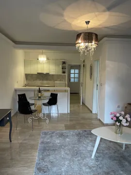 Living room with dining area and open kitchen. - image 13