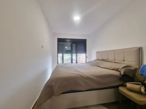 Furnished bedroom with a double bed and access to the terrace. - image 9