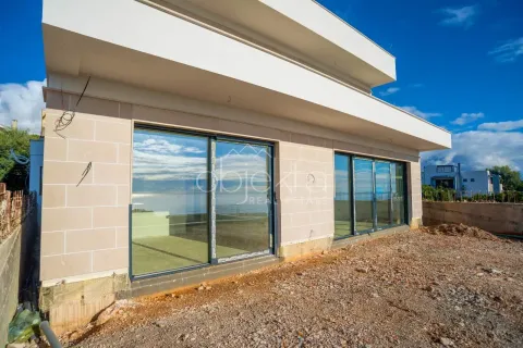 Exterior view of a modern building with large glass openings. - image 6