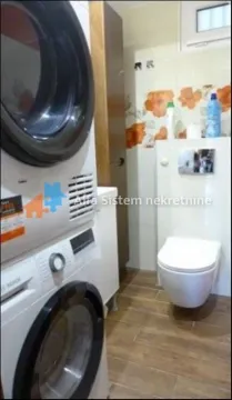 Bathroom equipped with sanitary ware and washing machines. - image 17