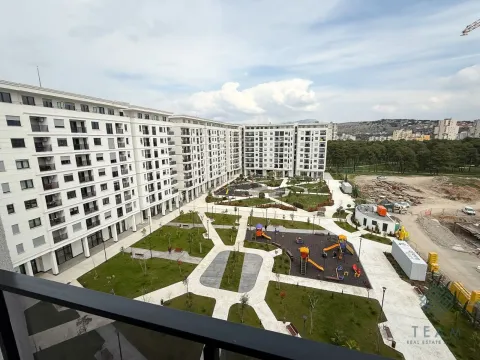 View from the terrace overlooking the courtyard and surrounding residential buildings. - image 9