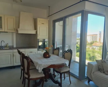 Dining area connected to the kitchen with access to the terrace. - image 9