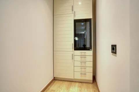 Built-in kitchen cabinets with a built-in refrigerator in a niche. - image 8