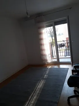 Empty room with a large window and access to the terrace. - image 2