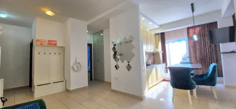 Living room with dining area and kitchen in the background. - image 6