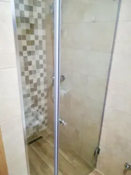 Shower cabin with glass door and ceramic tiles in the bathroom. - image 5