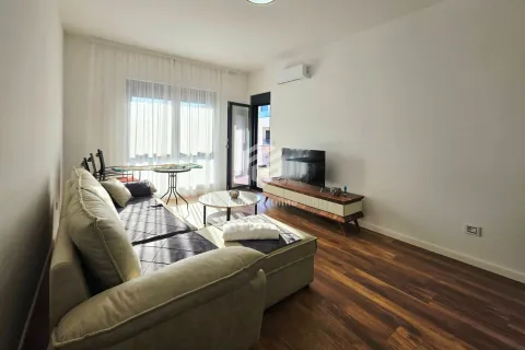 Living room with a sofa, TV, and access to the terrace. - image 12
