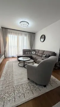 Spacious living room with a sofa set and access to the terrace. - image 2