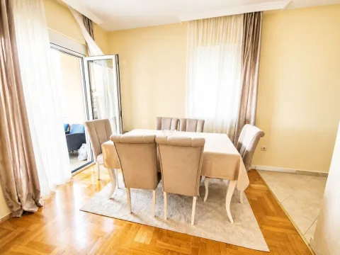 Dining area with a table, chairs, and access to the terrace. - image 5