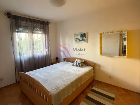 Bedroom with a double bed, window, and a wall mirror. - image 10