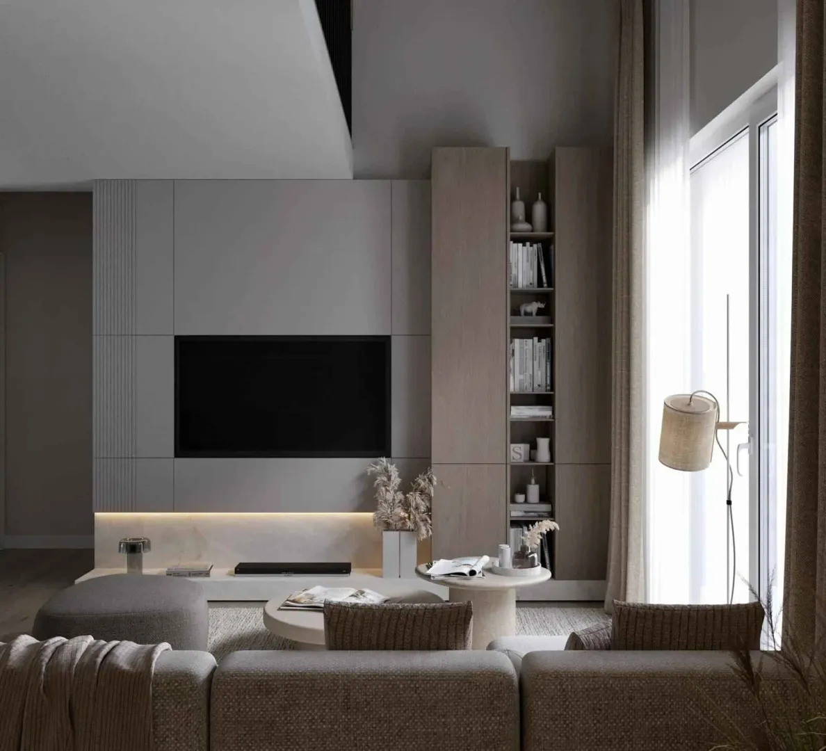 Modern living room with a sofa, TV, and built-in bookshelf.