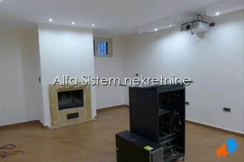 Living room with a built-in fireplace and projector. - image 16