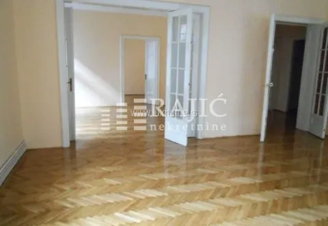 Empty room with hardwood floors and open doorways leading to other areas. - image 3