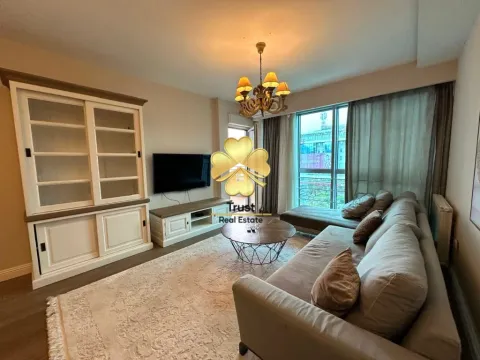 Spacious living room with a sofa set, large cabinet, and access to the terrace. - image 2