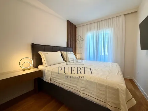 Modern bedroom with a double bed and a nightstand. - image 7