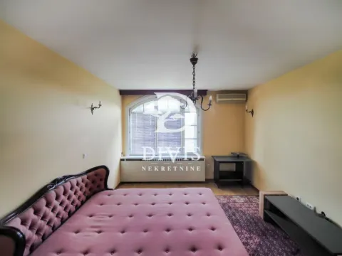Spacious bedroom with a large double bed and a window. - image 8