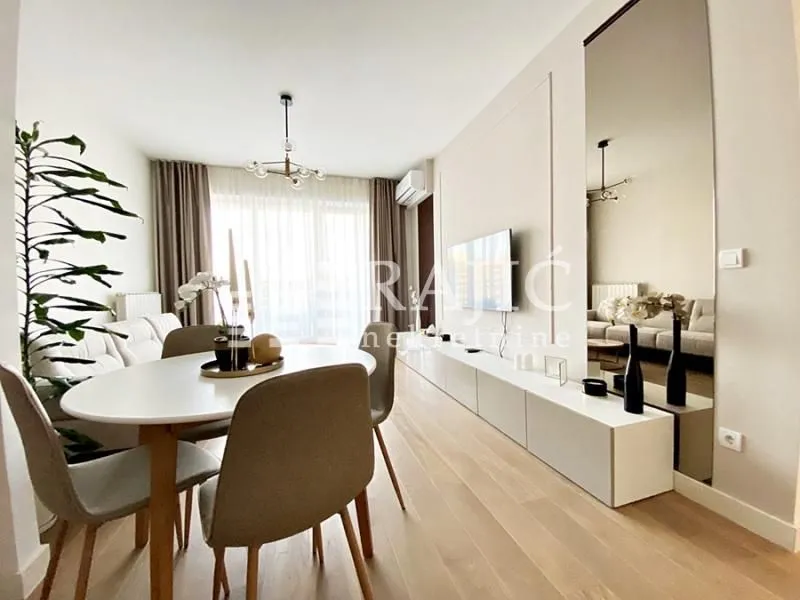 Living room with dining area and modern furniture.