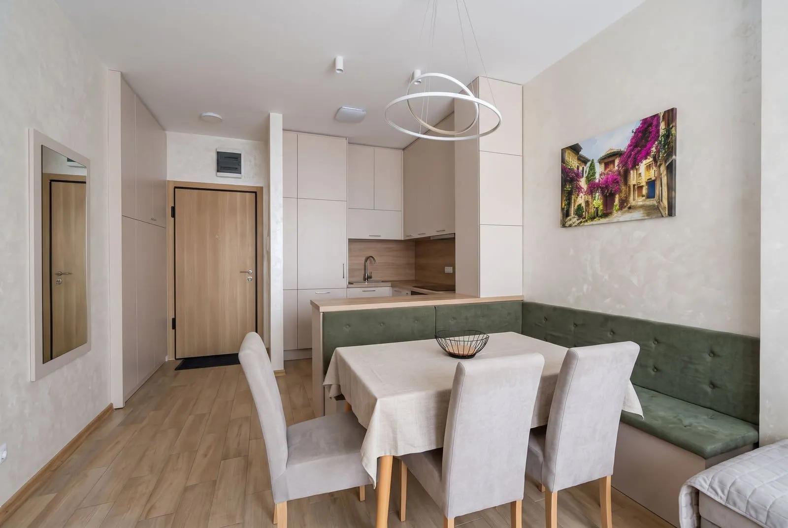 Living room with dining area and kitchen in the background.