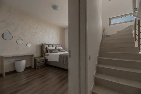 View from the hallway towards the bedroom and stairs. - image 13