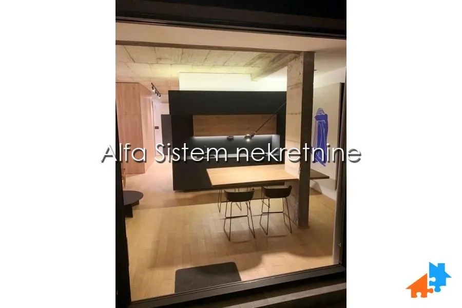 Modern kitchen with a breakfast bar and dining table.