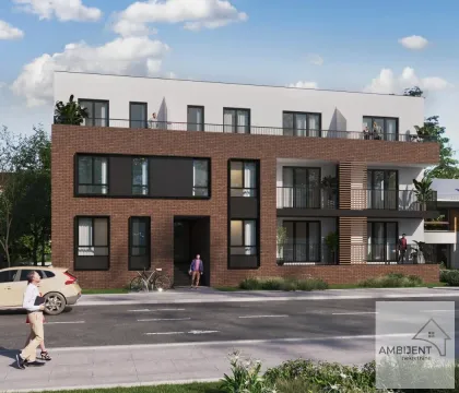 Spoljašnji izgled moderne stambene zgrade sa balkonom i uređenom fasadom. - image 3