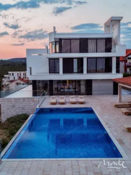 Exterior of a modern villa with a swimming pool and sun terrace. - image 24