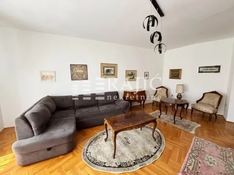 Spacious living room with sofa and parquet flooring. - image 2