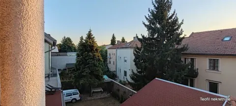 View of the courtyard and surrounding buildings from the terrace. - image 8