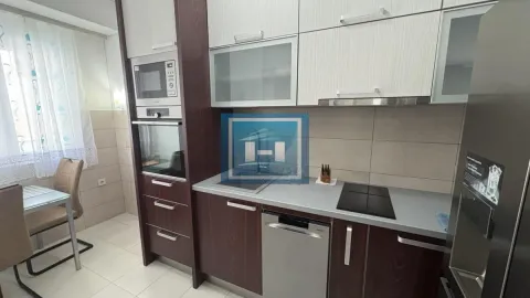 Equipped kitchen with wooden cabinets and built-in appliances. - image 6
