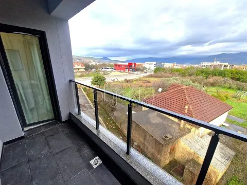 View from the balcony overlooking the surrounding neighborhood and hills in the distance. - image 3