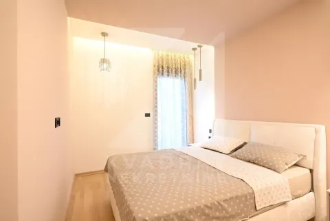 Bedroom with a double bed and a window with curtains. - image 12