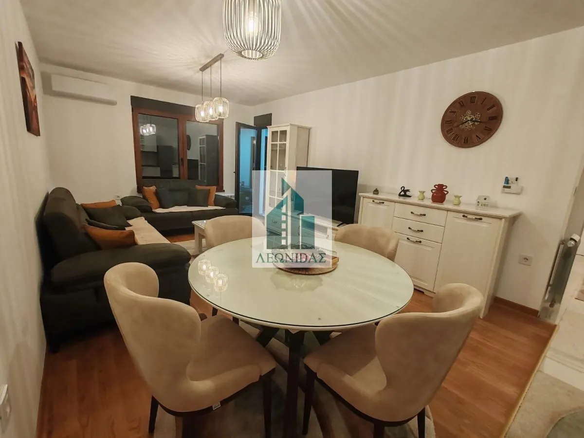 Living room with a dining area and seating furniture.