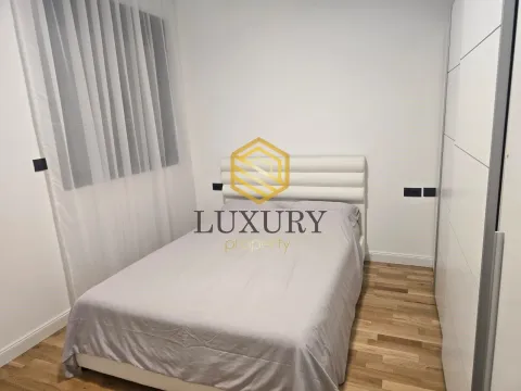 Modern bedroom with a double bed and wardrobe. - image 10