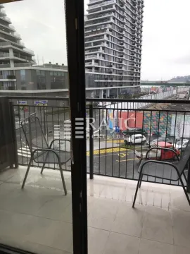 View from the balcony overlooking the urban surroundings and nearby buildings. - image 18