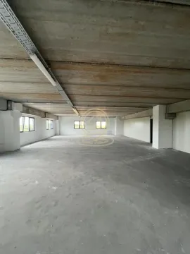 Large unfinished space in bare shell condition with a concrete ceiling and columns. - image 8