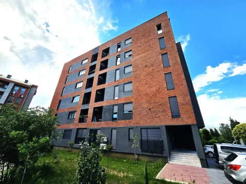 Exterior of a modern residential building with a brick facade. - image 31