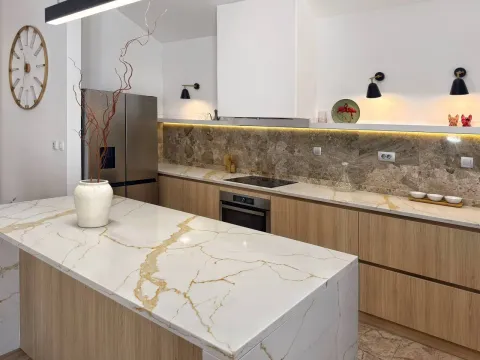 Modern kitchen with white elements, marble countertops, and wooden details. - image 3