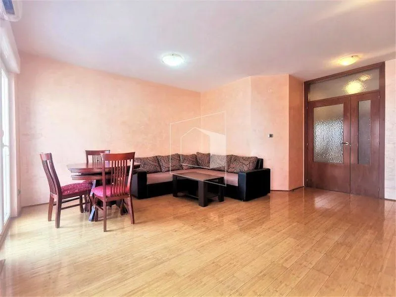 Living room with sofa and dining table.