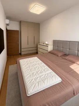 Modern bedroom with a double bed, wardrobe, and chest of drawers. - image 8