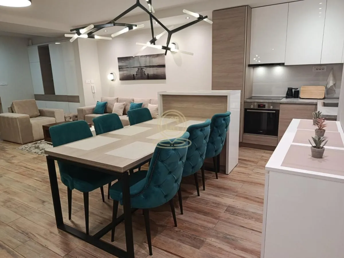 Open-plan living room with dining area and kitchen.